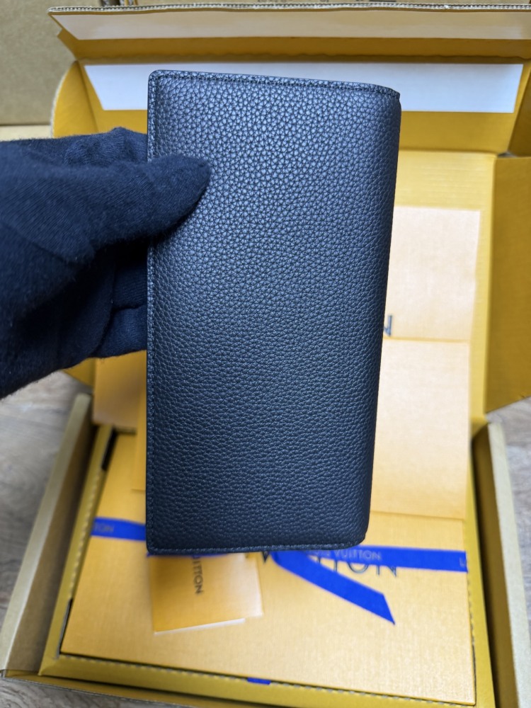The Louis Vuitton LV Aerogram long bi-fold wallet is crafted from grained cowhide leather, a material specifically developed by the brand for men.