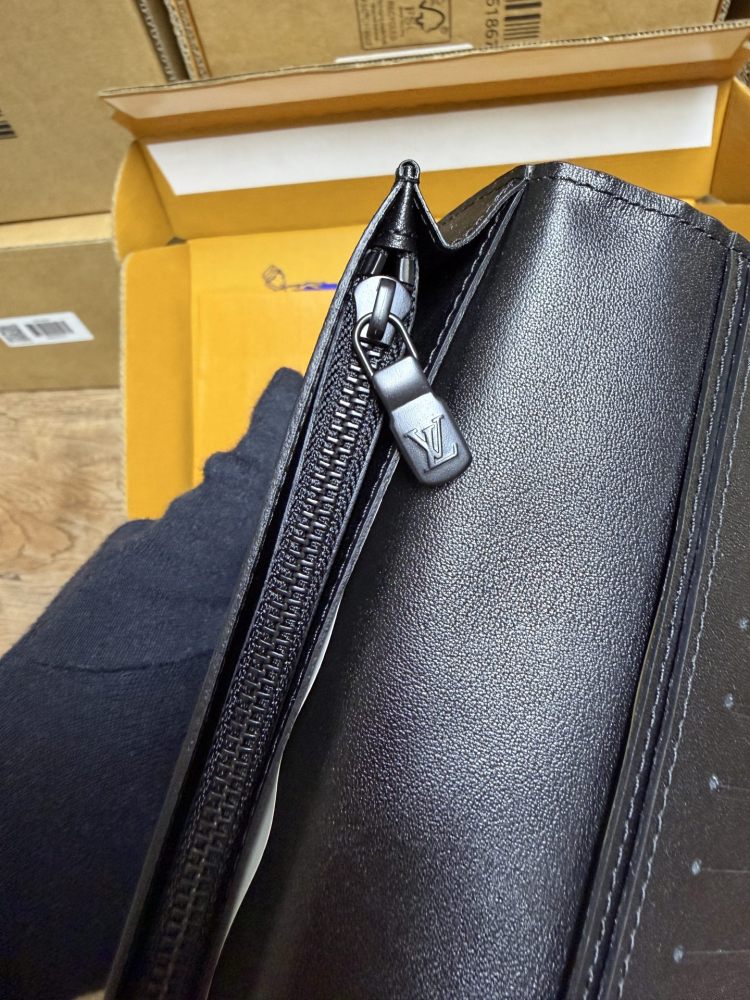 The Louis Vuitton LV Aerogram long bi-fold wallet is crafted from grained cowhide leather, a material specifically developed by the brand for men.