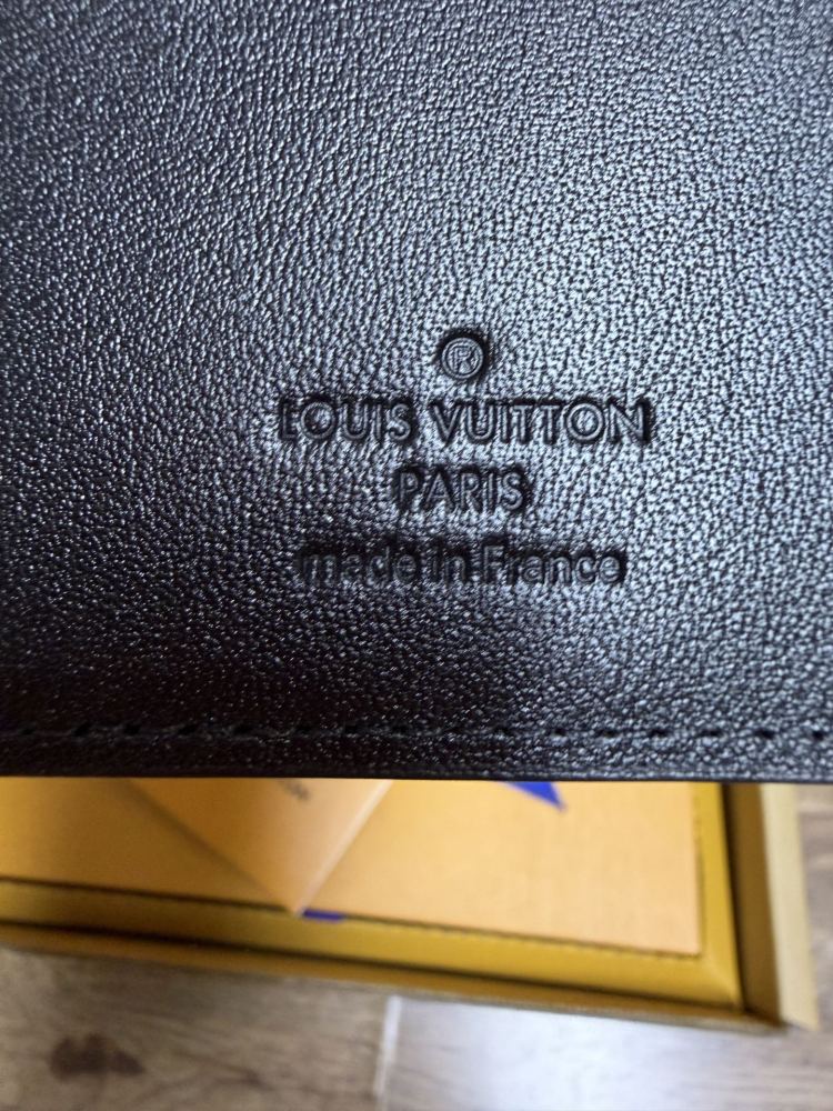 The Louis Vuitton LV Aerogram long bi-fold wallet is crafted from grained cowhide leather, a material specifically developed by the brand for men.
