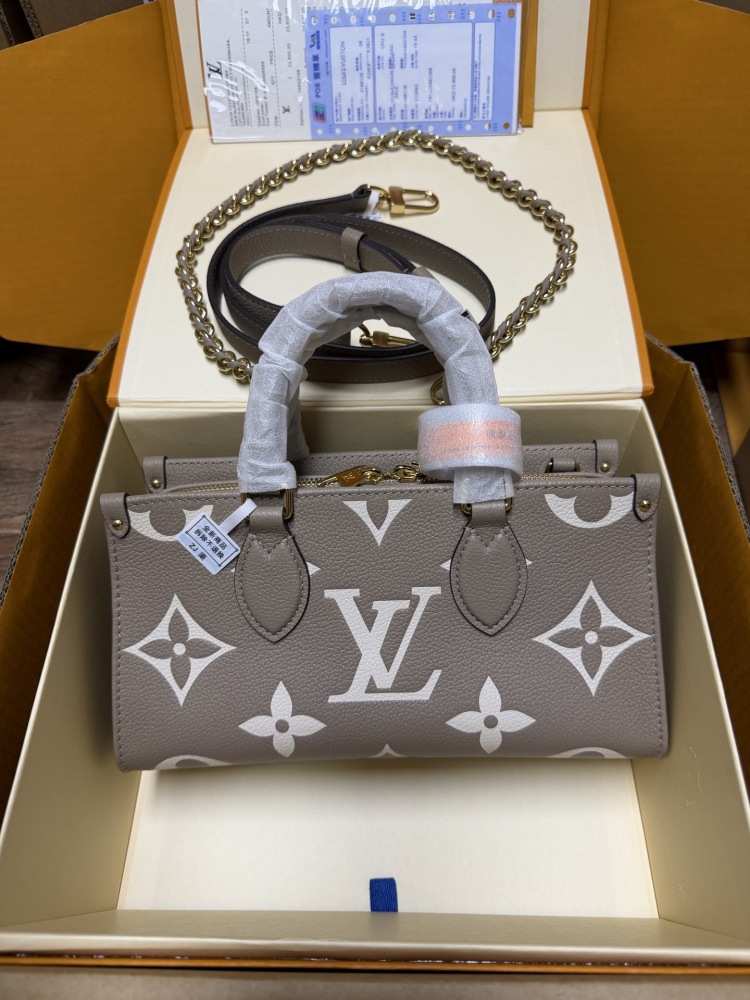 Louis Vuitton OnTheGo East-West Small Handbag, featuring a Grey/White colorway in Monogram Empreinte embossed cowhide.