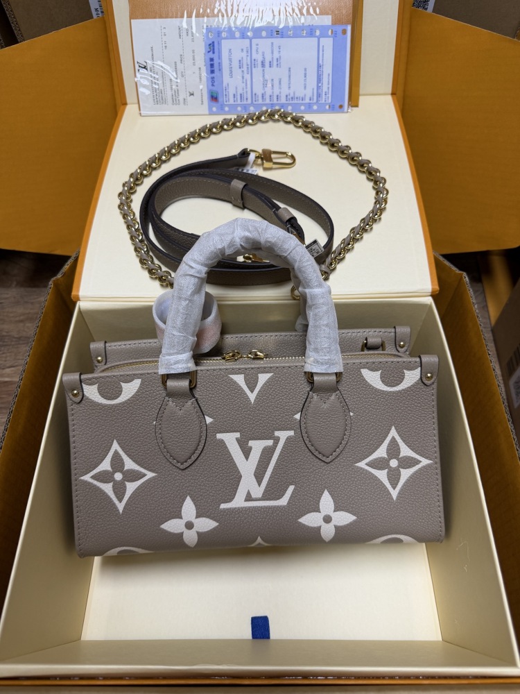 Louis Vuitton OnTheGo East-West Small Handbag, featuring a Grey/White colorway in Monogram Empreinte embossed cowhide.