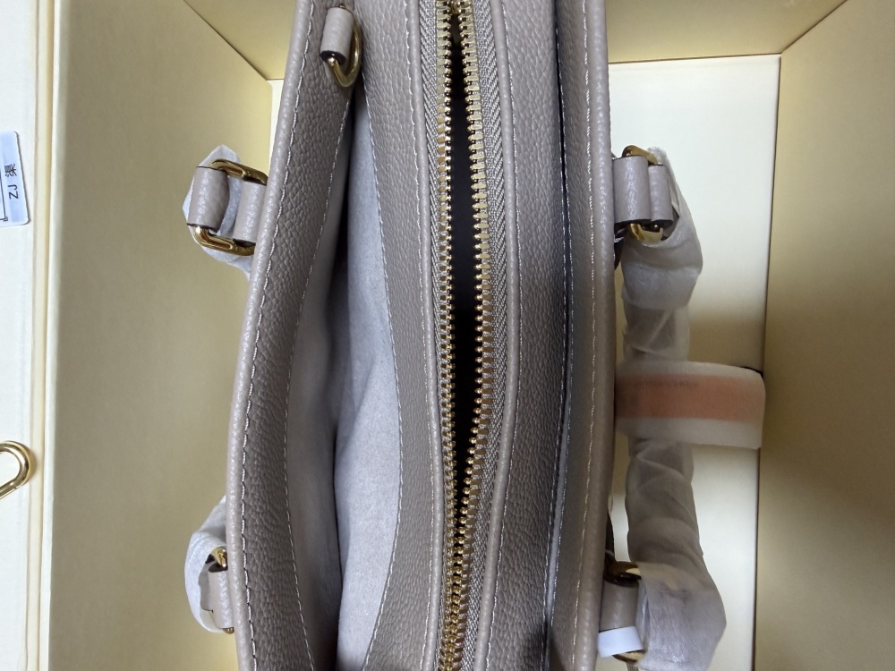 Louis Vuitton OnTheGo East-West Small Handbag, featuring a Grey/White colorway in Monogram Empreinte embossed cowhide.