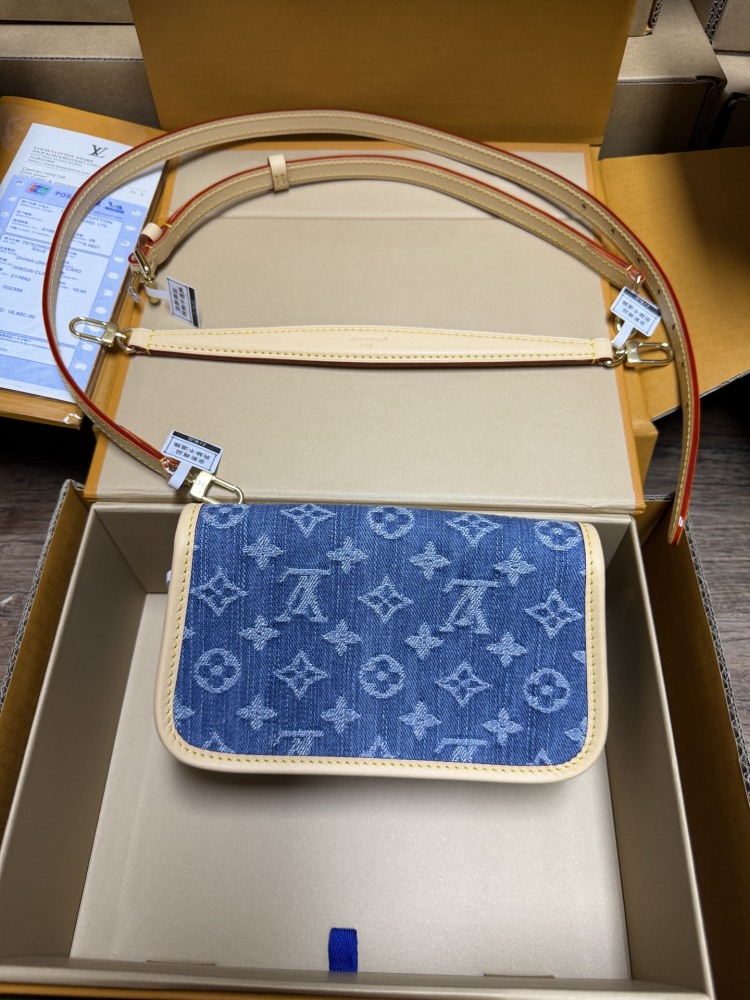 The Louis Vuitton Nano Diane mini baguette bag features the brand's iconic Monogram denim canvas.