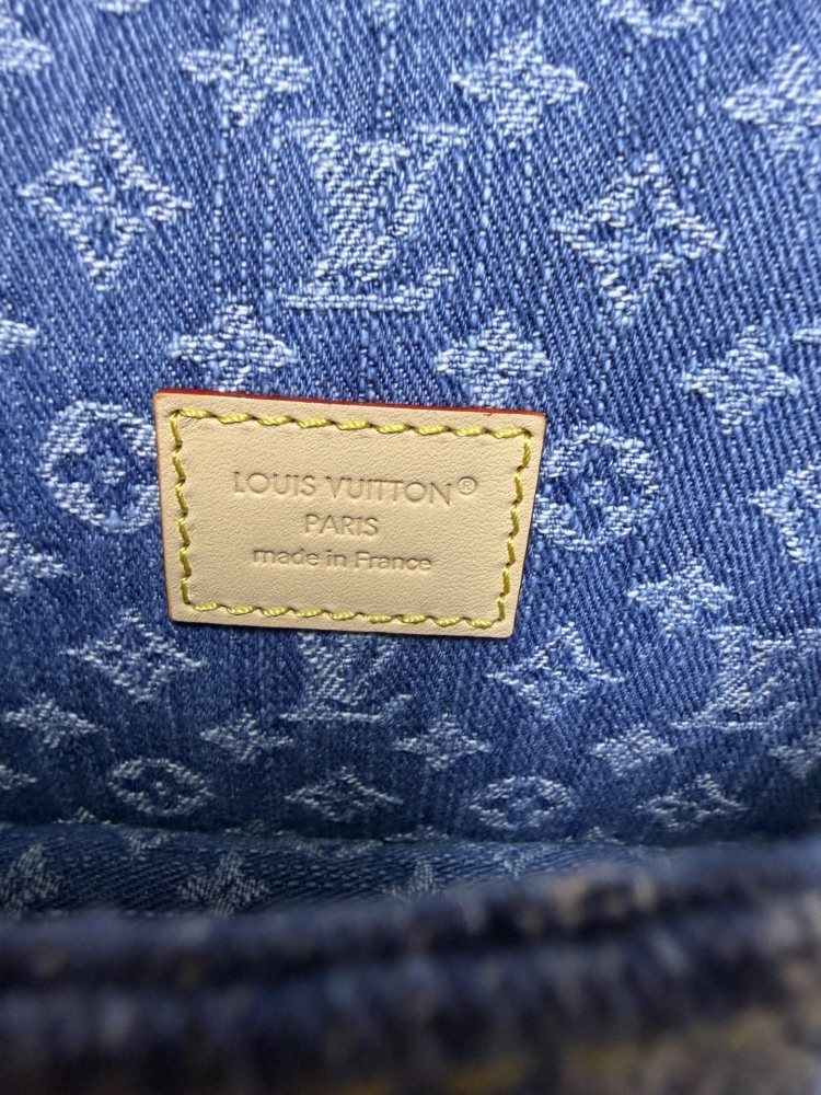 The Louis Vuitton Nano Diane mini baguette bag features the brand's iconic Monogram denim canvas.