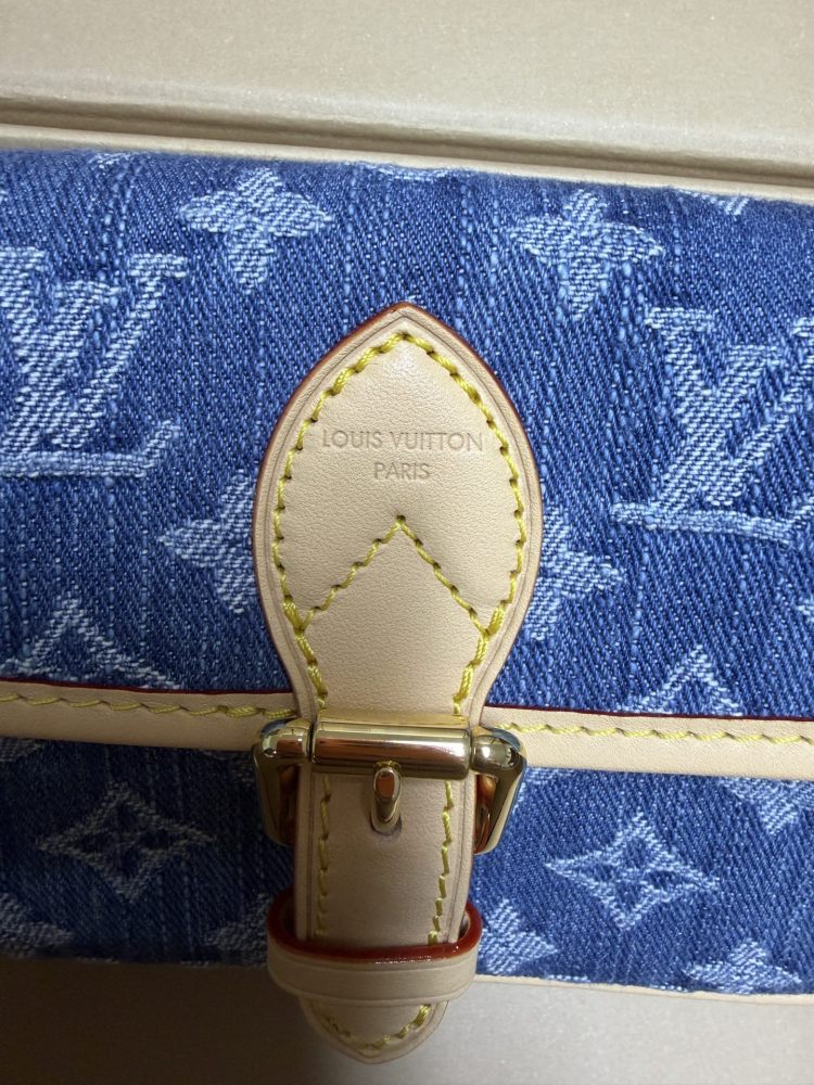 The Louis Vuitton Nano Diane mini baguette bag features the brand's iconic Monogram denim canvas.