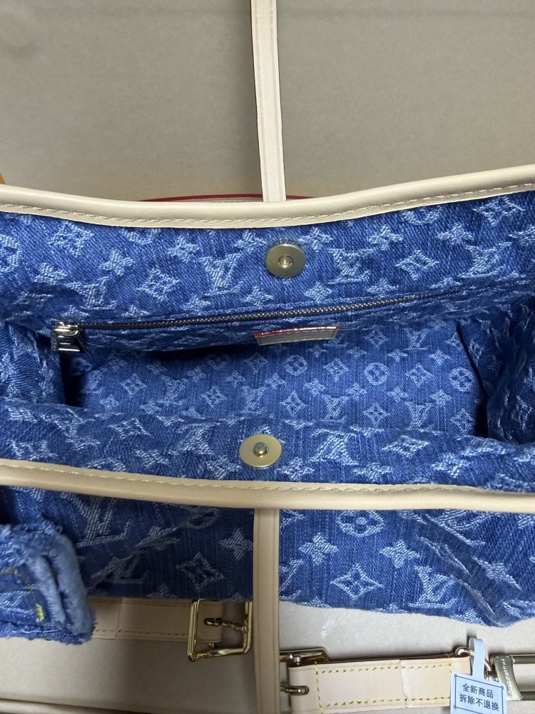 The Louis Vuitton Carryall Denim handbag is a highly sought-after, retro-style shoulder bag that has enjoyed immense popularity in recent years.