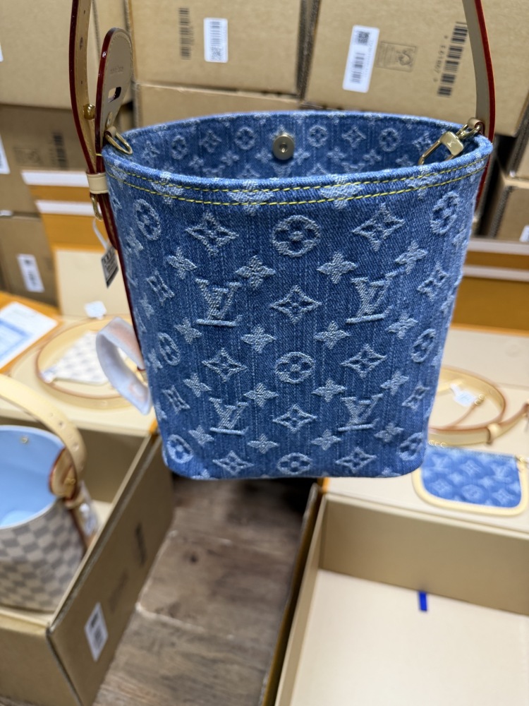 The Louis Vuitton Nano Bucket bag features the Monogram Denim canvas—a highly popular material in recent years.