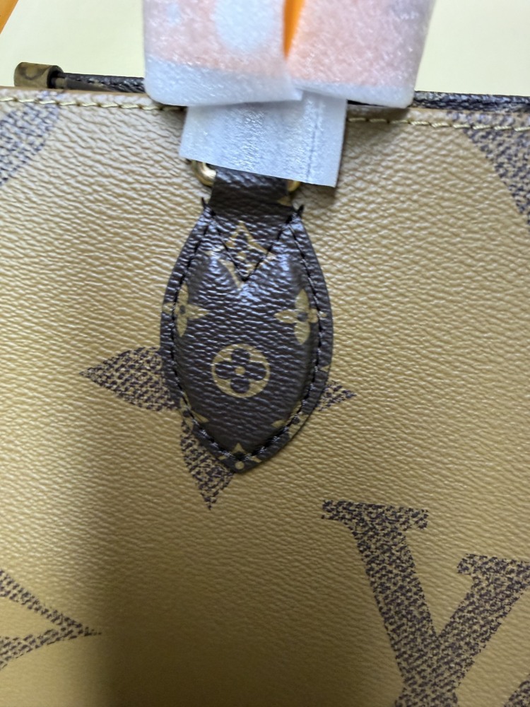 The Louis Vuitton OnTheGo PM small tote bag, crafted from the classic Monogram Giant canvas.