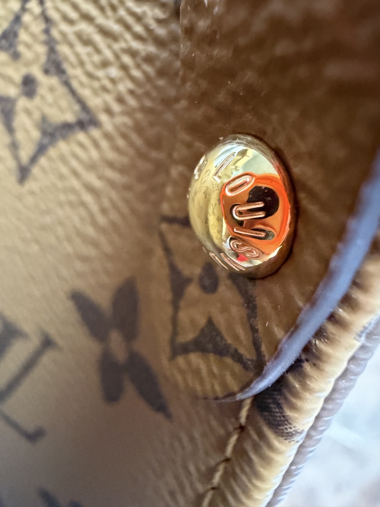 The Louis Vuitton OnTheGo PM small tote bag, crafted from the classic Monogram Giant canvas.