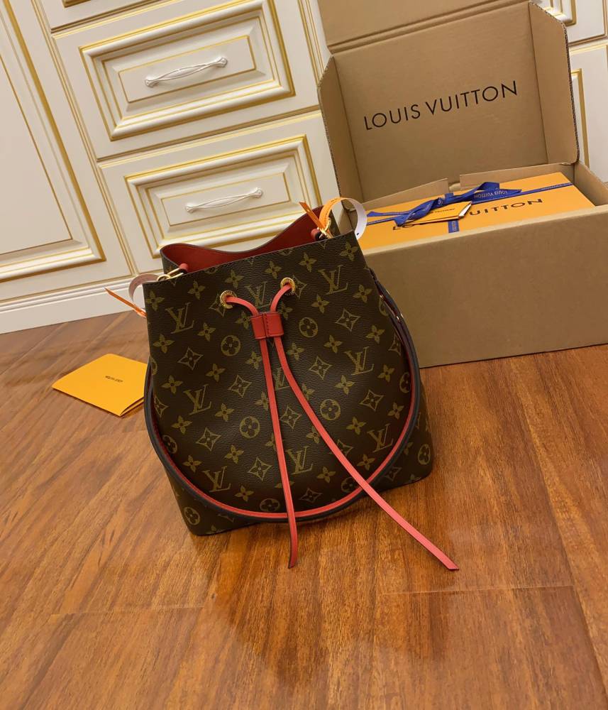 The Louis Vuitton NéoNoé MM bucket bag features the classic Monogram canvas, paired with a vibrant red lining and drawstring.