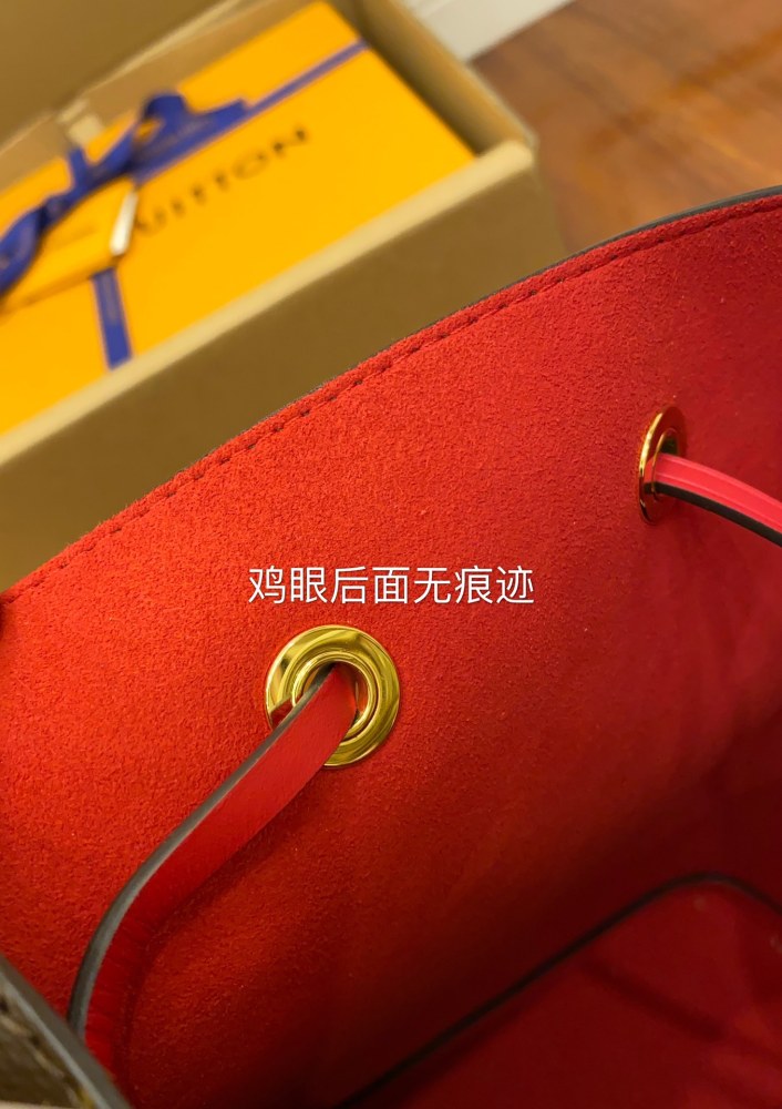 The Louis Vuitton NéoNoé MM bucket bag features the classic Monogram canvas, paired with a vibrant red lining and drawstring.