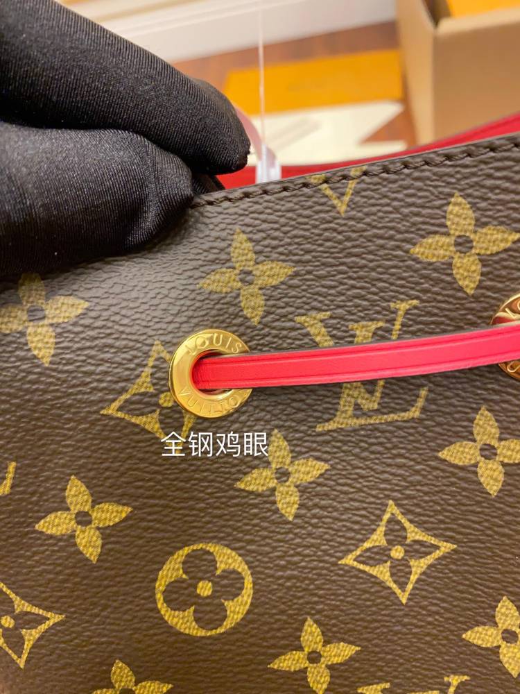The Louis Vuitton NéoNoé MM bucket bag features the classic Monogram canvas, paired with a vibrant red lining and drawstring.