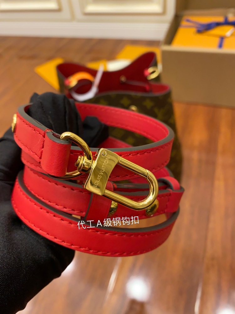 The Louis Vuitton NéoNoé MM bucket bag features the classic Monogram canvas, paired with a vibrant red lining and drawstring.