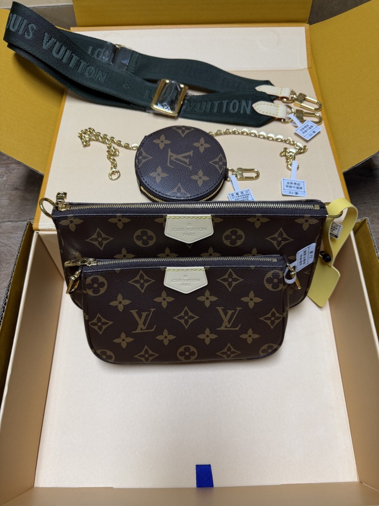 The Louis Vuitton Multi Pochette Accessoires features the brand's classic Monogram canvas, paired with a popular wide green shoulder strap.