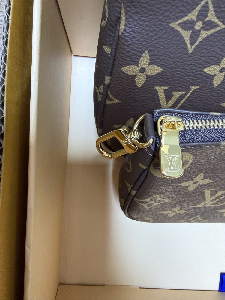 The Louis Vuitton Multi Pochette Accessoires features the brand's classic Monogram canvas, paired with a popular wide green shoulder strap.