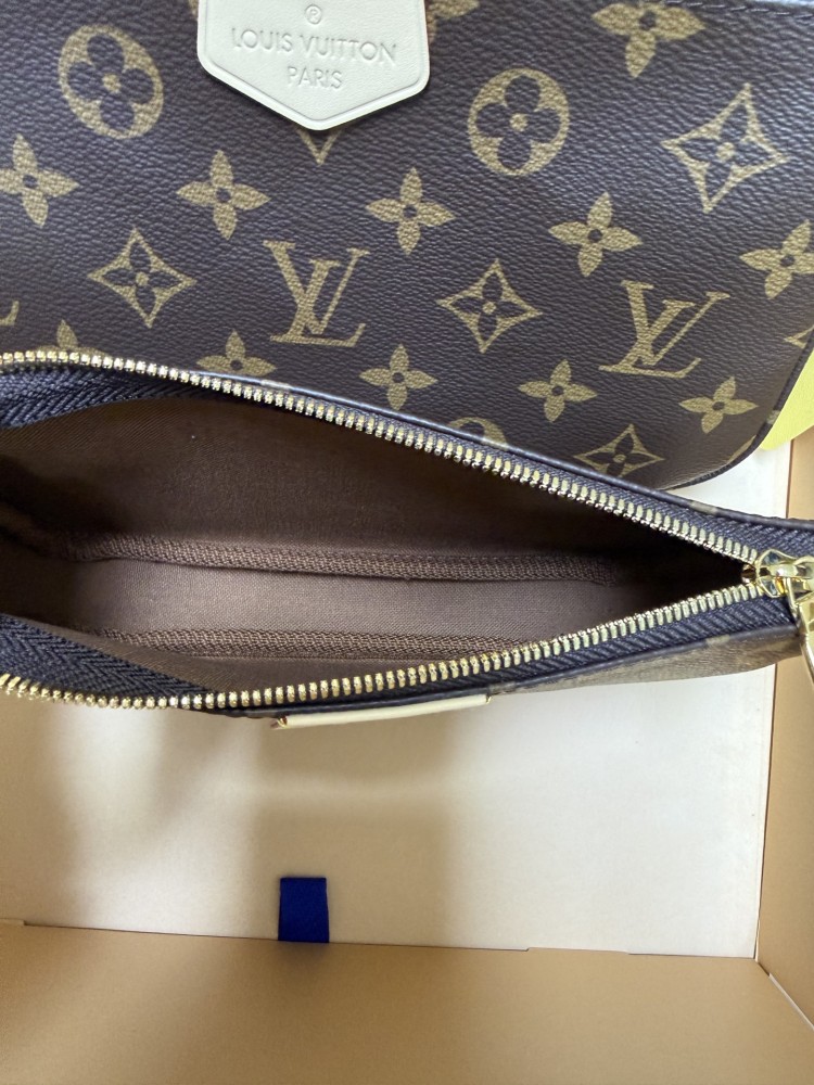 The Louis Vuitton Multi Pochette Accessoires features the brand's classic Monogram canvas, paired with a popular wide green shoulder strap.