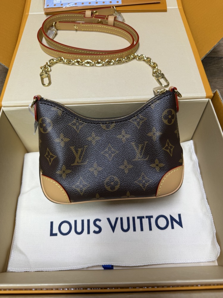 The Louis Vuitton LV Mini Hobo—often referred to as the "Moon Bag"—is crafted from the brand's classic Monogram canvas.