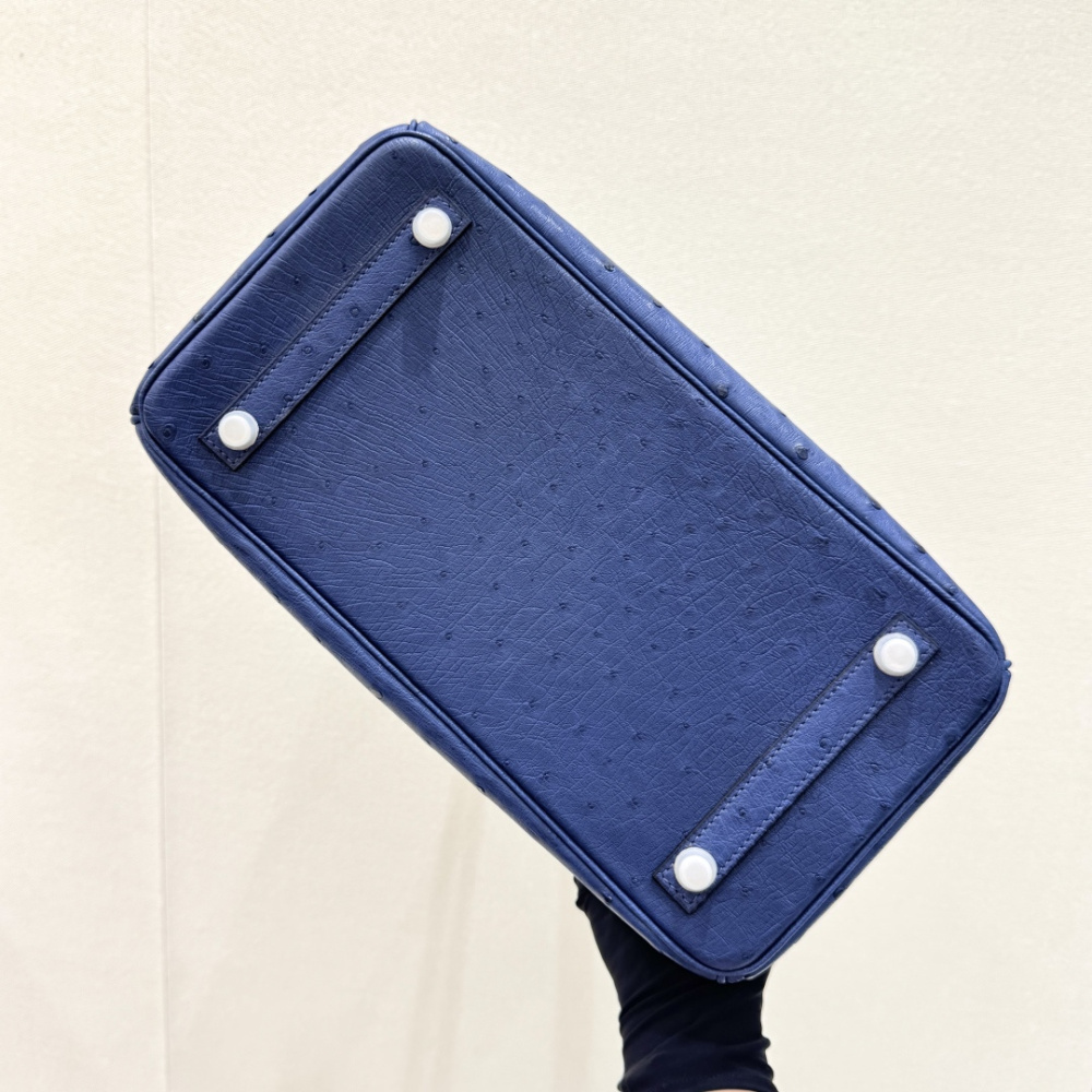 The Hermès Birkin 30 Ostrich Leather Handbag—featuring a Deep Sea Blue hue paired with silver hardware—stands as one of the brand's flagship models crafted from its most exclusive and rare leathers.
