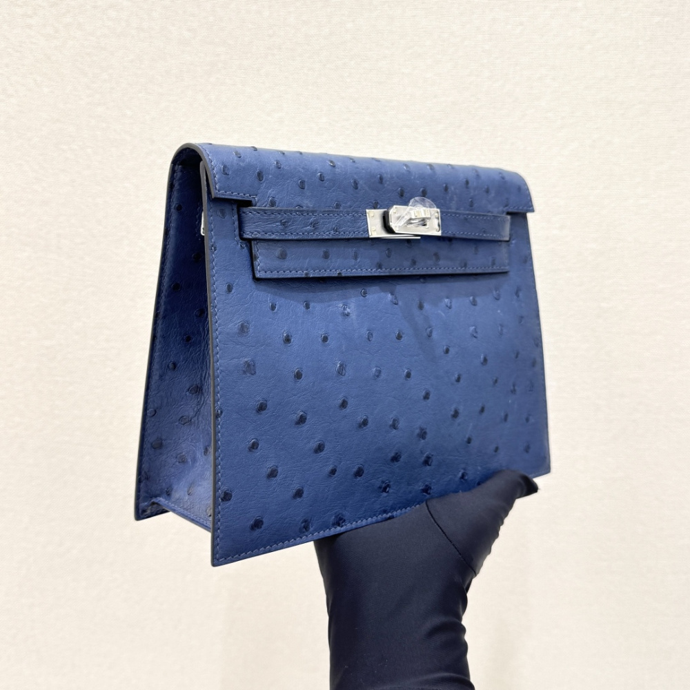 The Hermès Kelly Danse handbag in ostrich leather—rendered in a misty blue hue (variously described as Sailor Blue or Atlantic Blue) and accented with silver hardware—stands as an iconic exemplar of cool, sophisticated elegance within the brand's rare lea