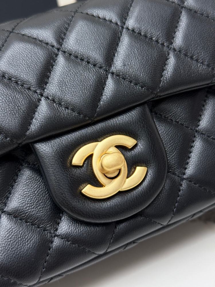 This is a small Chanel Classic Flap bag with a pearl crush charm (often referred to as the "Golden Ball CF") from Chanel, featuring the brand's iconic lambskin and diamond-quilted pattern.
