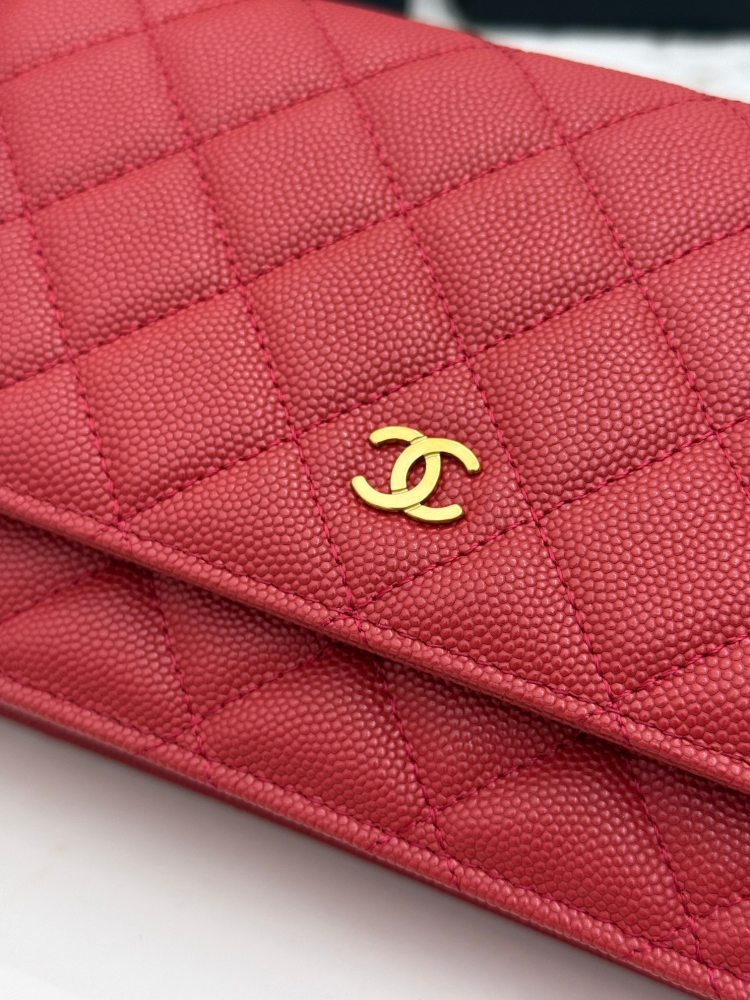 Chanel Wallet on Chain (WOC) crafted in bright red caviar leather with gold-tone hardware.
