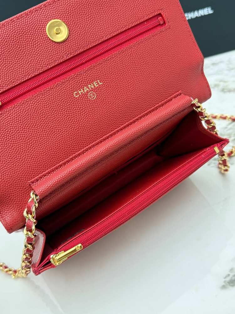 Chanel Wallet on Chain (WOC) crafted in bright red caviar leather with gold-tone hardware.