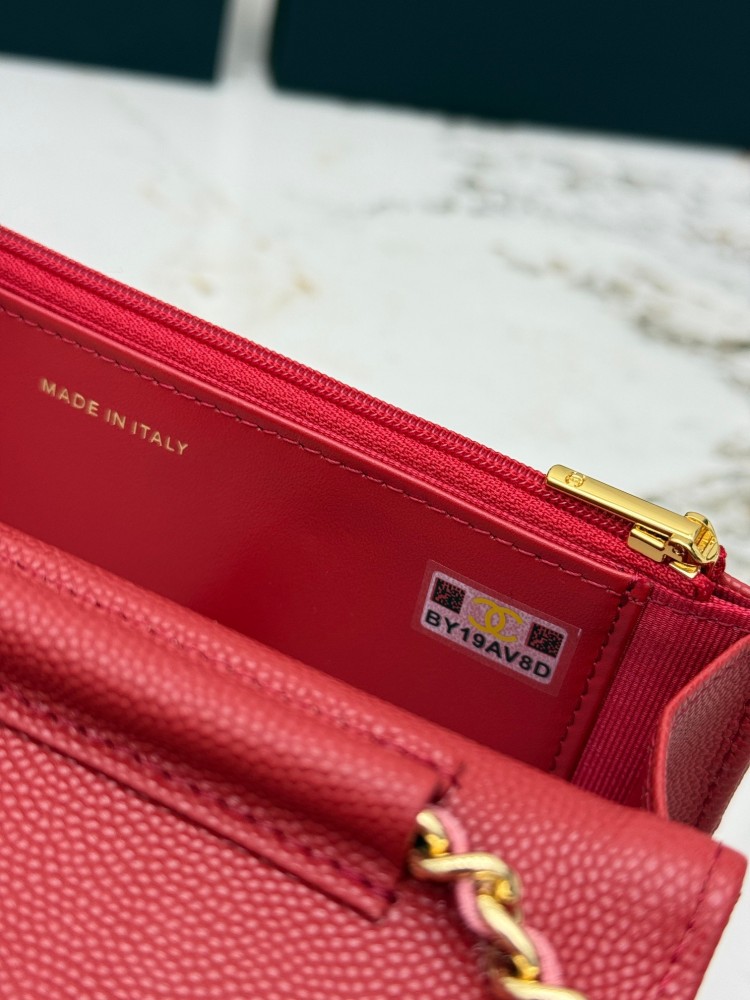 Chanel Wallet on Chain (WOC) crafted in bright red caviar leather with gold-tone hardware.
