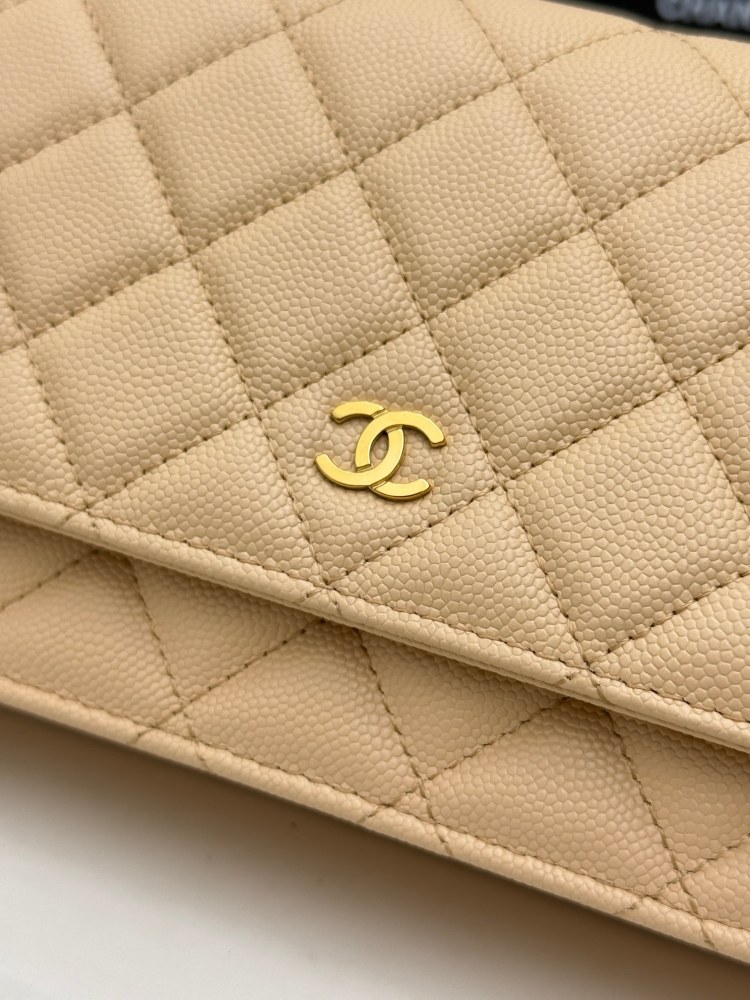 Chanel Wallet on Chain (WOC) crafted in beige caviar leather with gold-tone hardware.