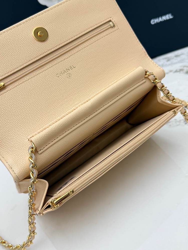 Chanel Wallet on Chain (WOC) crafted in beige caviar leather with gold-tone hardware.