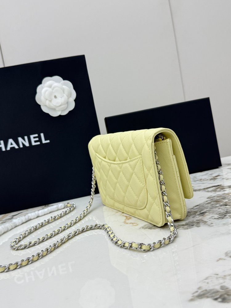 Chanel Wallet on Chain (WOC) crafted in lemon yellow caviar leather with silver-tone hardware.