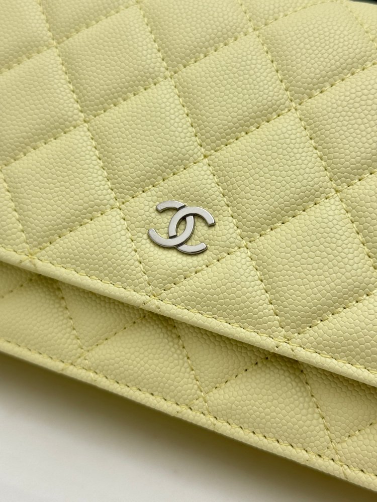 Chanel Wallet on Chain (WOC) crafted in lemon yellow caviar leather with silver-tone hardware.