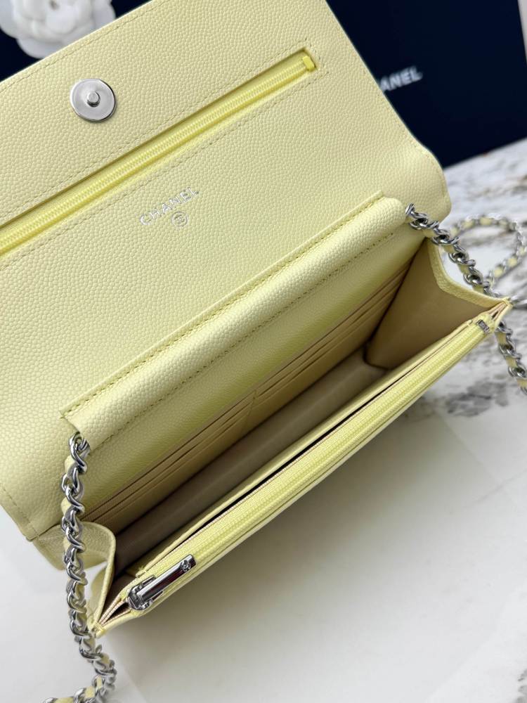 Chanel Wallet on Chain (WOC) crafted in lemon yellow caviar leather with silver-tone hardware.