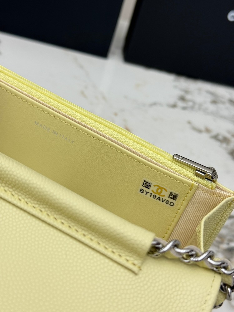 Chanel Wallet on Chain (WOC) crafted in lemon yellow caviar leather with silver-tone hardware.
