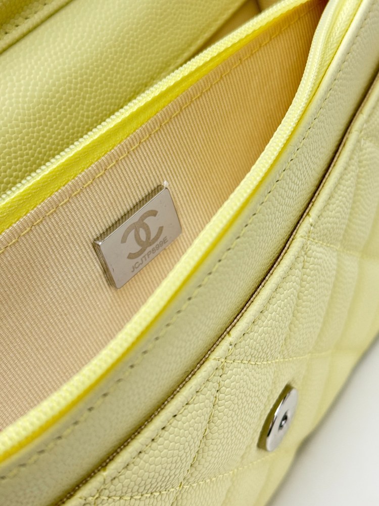 Chanel Wallet on Chain (WOC) crafted in lemon yellow caviar leather with silver-tone hardware.
