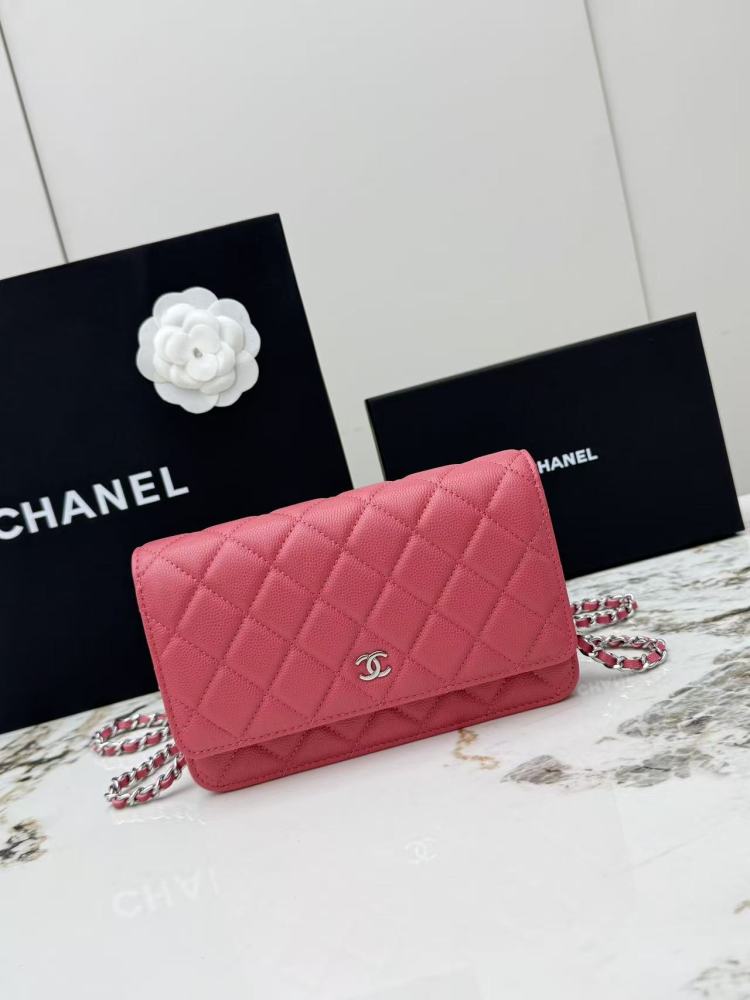 Chanel Wallet on Chain (WOC) crafted in rose pink caviar leather with silver-tone hardware.