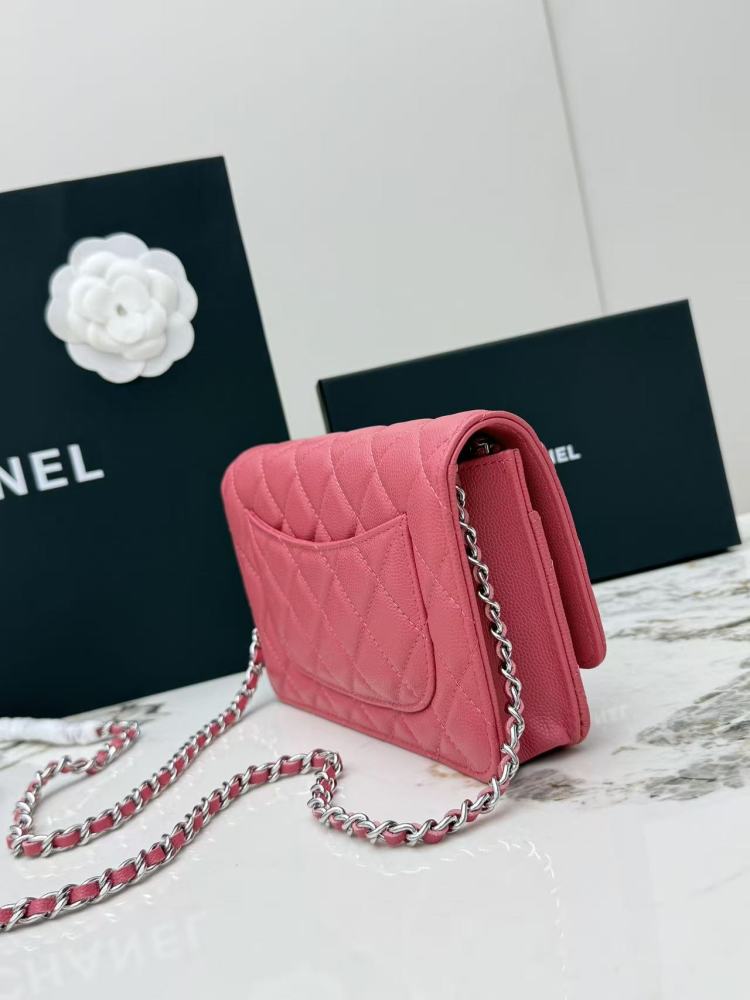 Chanel Wallet on Chain (WOC) crafted in rose pink caviar leather with silver-tone hardware.
