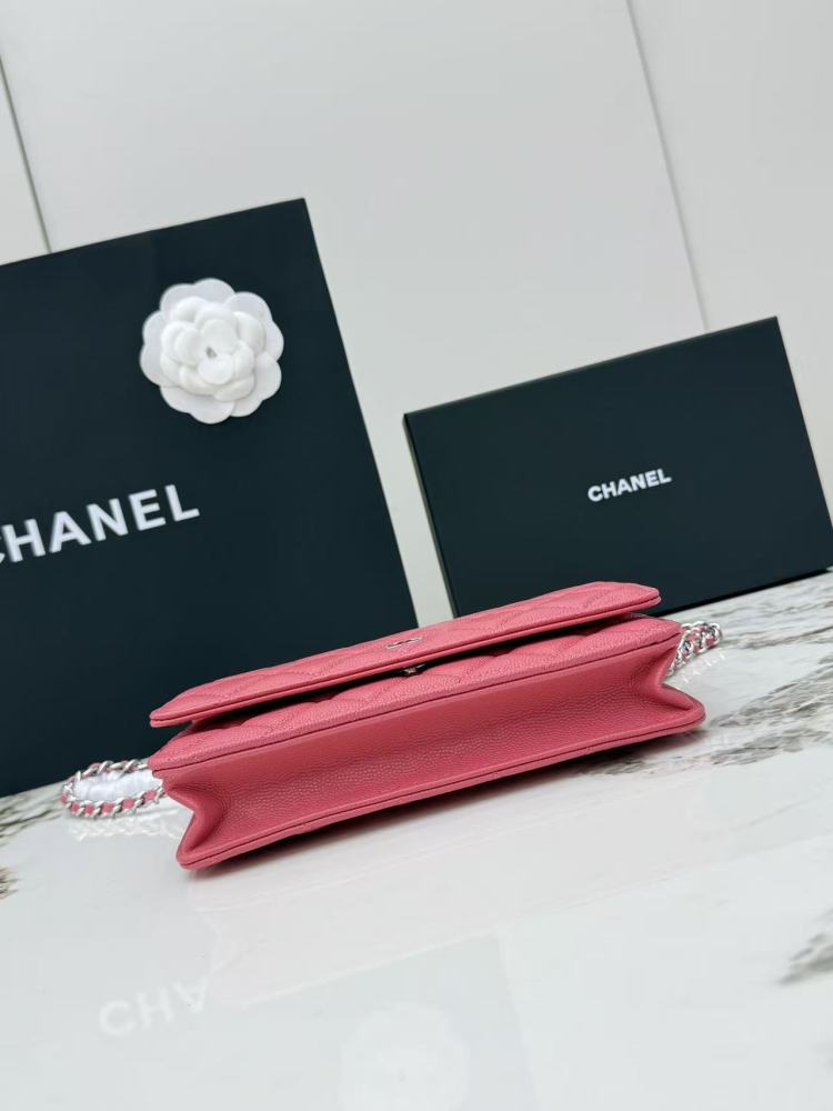 Chanel Wallet on Chain (WOC) crafted in rose pink caviar leather with silver-tone hardware.