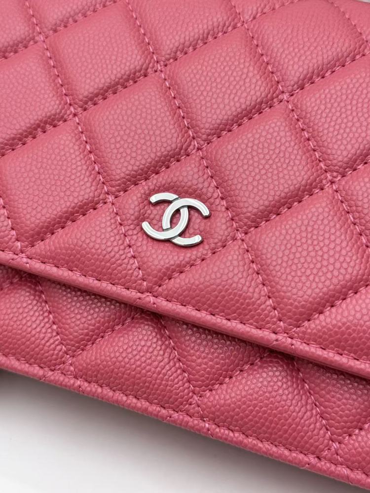 Chanel Wallet on Chain (WOC) crafted in rose pink caviar leather with silver-tone hardware.