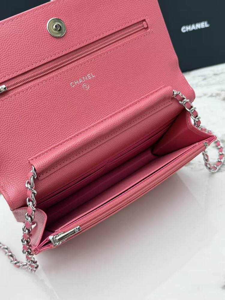 Chanel Wallet on Chain (WOC) crafted in rose pink caviar leather with silver-tone hardware.