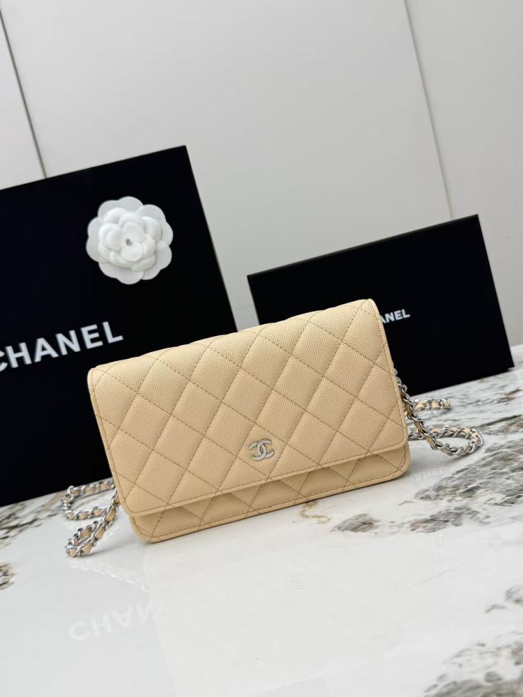 Chanel Wallet on Chain (WOC) crafted in light beige caviar leather with silver-tone hardware.