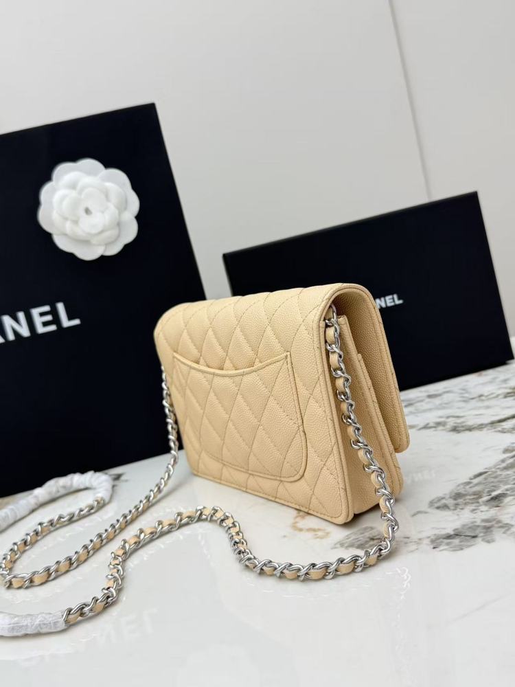 Chanel Wallet on Chain (WOC) crafted in light beige caviar leather with silver-tone hardware.