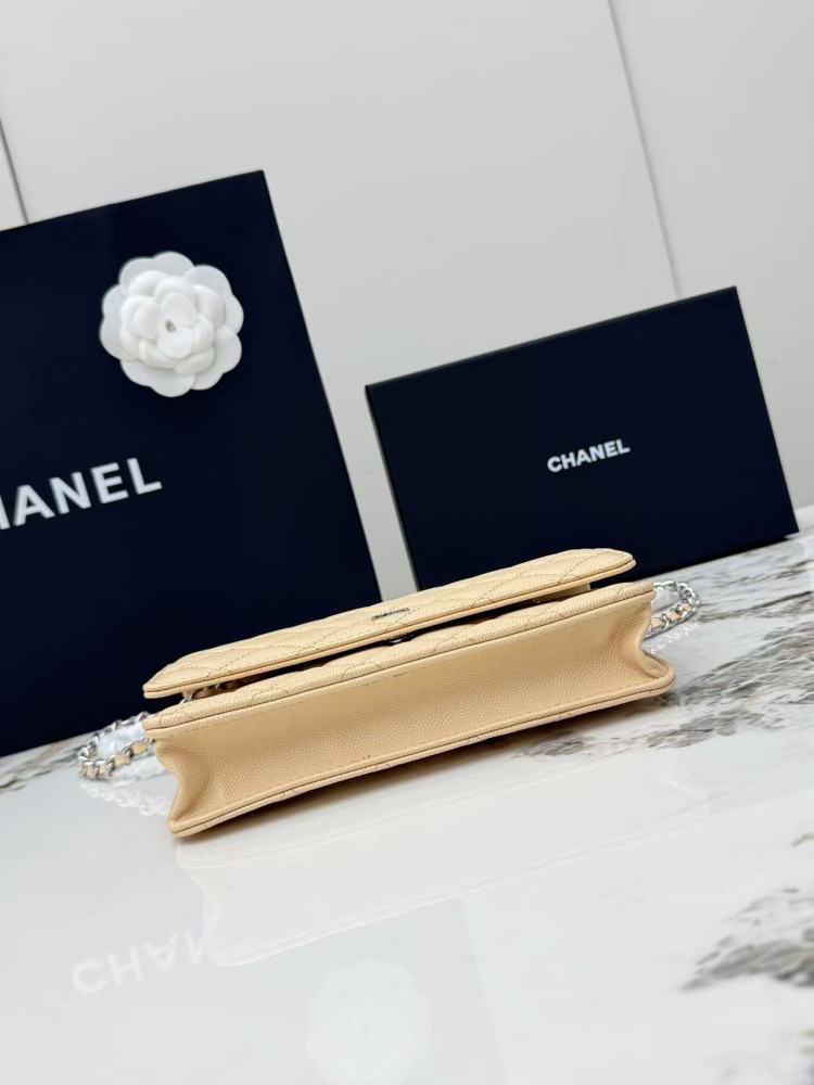 Chanel Wallet on Chain (WOC) crafted in light beige caviar leather with silver-tone hardware.