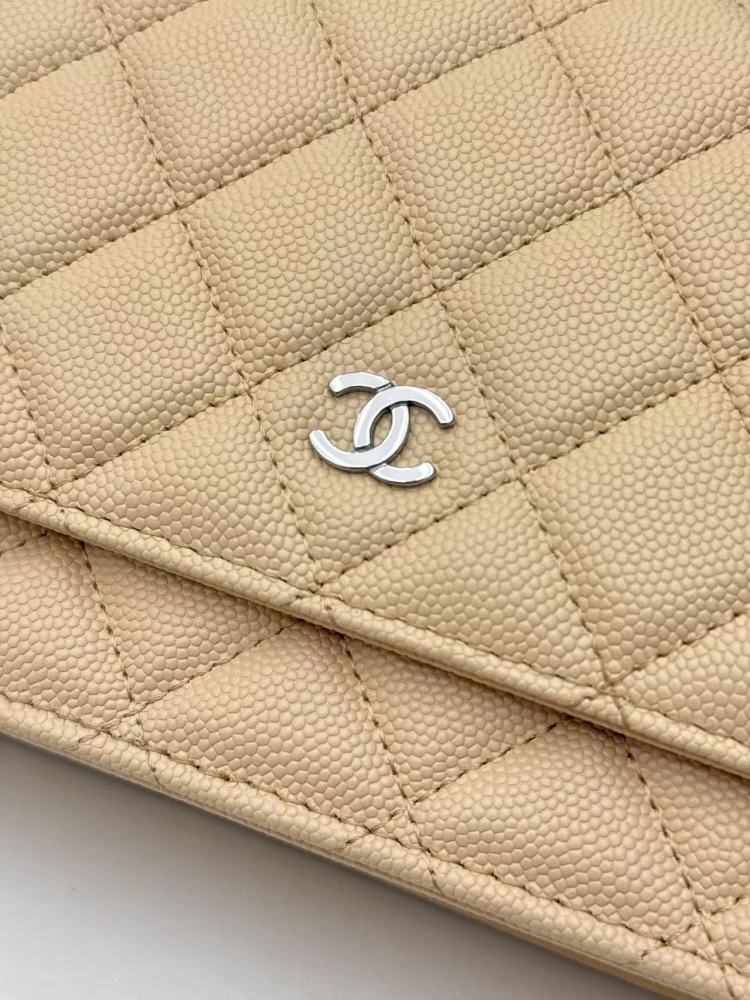 Chanel Wallet on Chain (WOC) crafted in light beige caviar leather with silver-tone hardware.