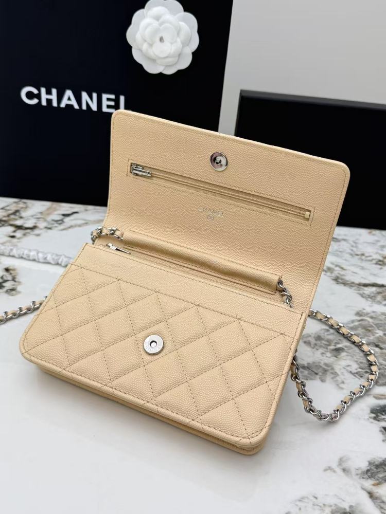 Chanel Wallet on Chain (WOC) crafted in light beige caviar leather with silver-tone hardware.