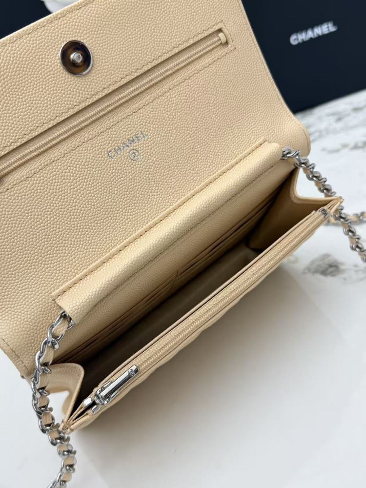 Chanel Wallet on Chain (WOC) crafted in light beige caviar leather with silver-tone hardware.