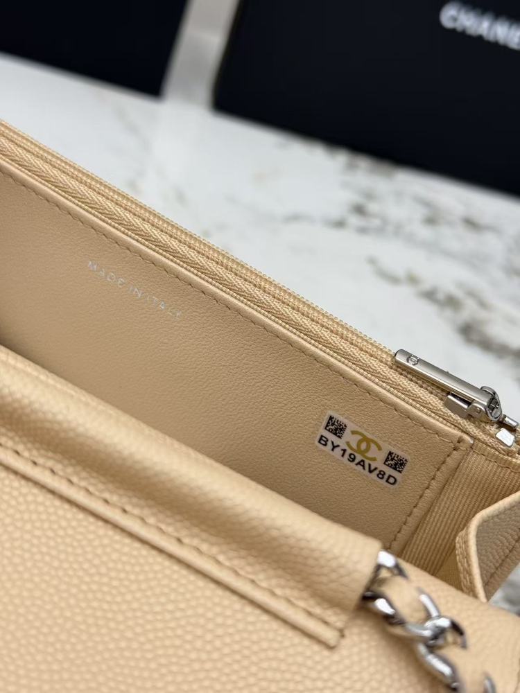Chanel Wallet on Chain (WOC) crafted in light beige caviar leather with silver-tone hardware.