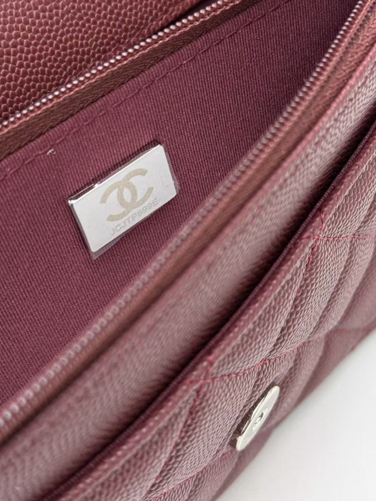 Chanel Wallet on Chain (WOC) crafted in burgundy caviar leather with silver-tone hardware.