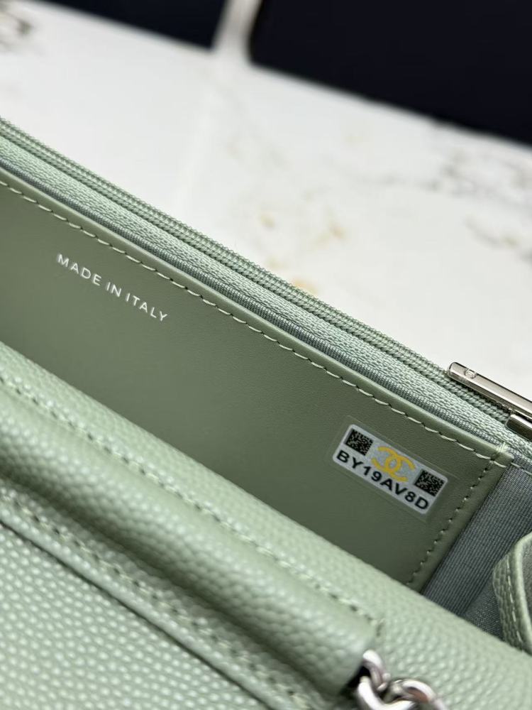 Chanel Wallet on Chain (WOC) crafted in sage green caviar leather with silver-tone hardware.