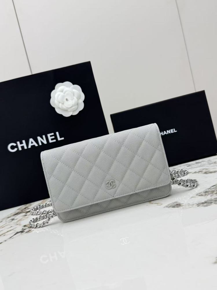 Chanel Wallet on Chain (WOC) crafted in light grey caviar leather with silver-tone hardware.