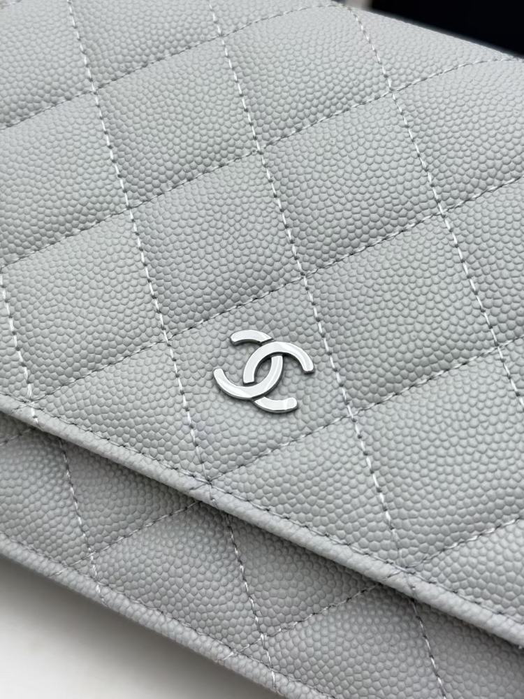 Chanel Wallet on Chain (WOC) crafted in light grey caviar leather with silver-tone hardware.